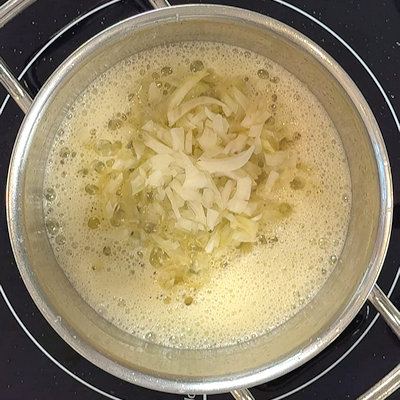 Step 1 - Heat butter in a pan and saute onion and garlic until soft and translucent.