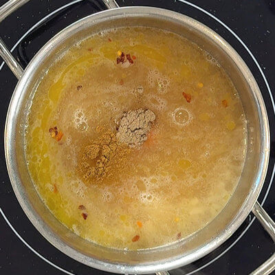 Step 3 - Add the broth, the spices (cardamom and cumin) and the salt.Place a lid on the pant, turn the heat up to medium-high, and bring the soup to a boil. Once boiling, turn the heat down to medium low and allow it to simmer for 15 minutes, stirring occasionally.