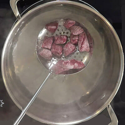 Step 5 - With a slotted spoon, place the gnocchi in the boiling water (do this is parts to avoid the water from cooling down). Cook the gnocchi until they float to the surface. Remove them from the pan and place them on a baking sheet, lined with parchment paper.