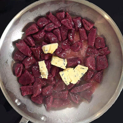 Step 6 - In a separate skillet, heat the butter and add the cooked gnocchi, plus 1/4 - 1/2 cup of gnocchi water. Add the blue cheese to that and stir until the cheese is melted and the sauce is just a little thickened. Season with salt & pepper.