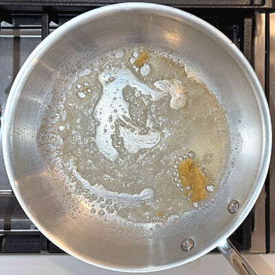 SStep 2 - Heat the butter in a pan, stir constantly and add the garlic past when the butter starts to brown. Stir until the paste is dispersed.