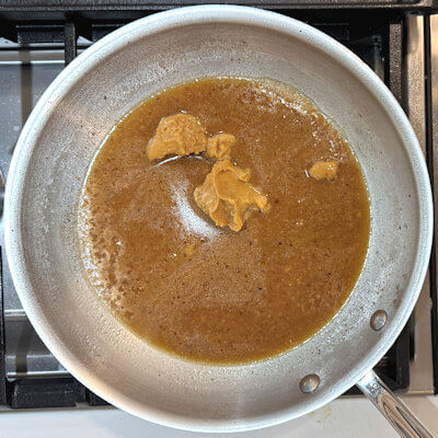 Step 3 - Add the chicken broth and the miso and stir on medium high heat until you have a smooth sauce. Don't boil the mixture.