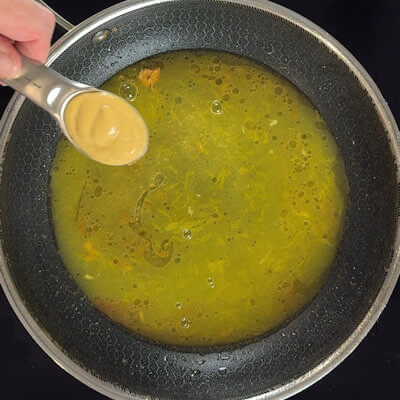 Step 3 - Wrap the the chicken breast in aluminum foil and keep warm. Transfer the orange juice to the same skillet and add the mustard. Stir until well blended.
