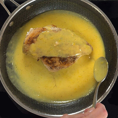 Step 5 - Return the chicken to the skillet and cover with the sauce.
