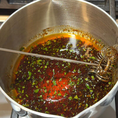 Step 1 - In a small saucepan, heat the maple syrup, olive oil and smoked paprika until well mixed. Add some finely chopped thyme.