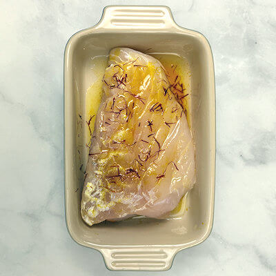 Step 2 - Season the grouper fillet(s) with salt and pepper and place the fish in a dish. Pour the saffron oil over the fish and turn the fish a few times, so all the sides are covered with the oil. Marinate for a minimum of 2 hours, or overnight. 