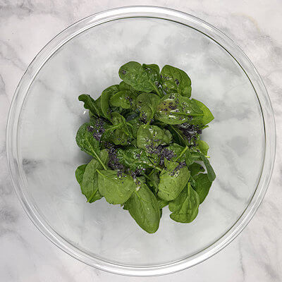 Step 1 - Make the dressing by mixing olive oil with orange juice, poppy seed and salt & pepper. Toss the dressing with the spinach.