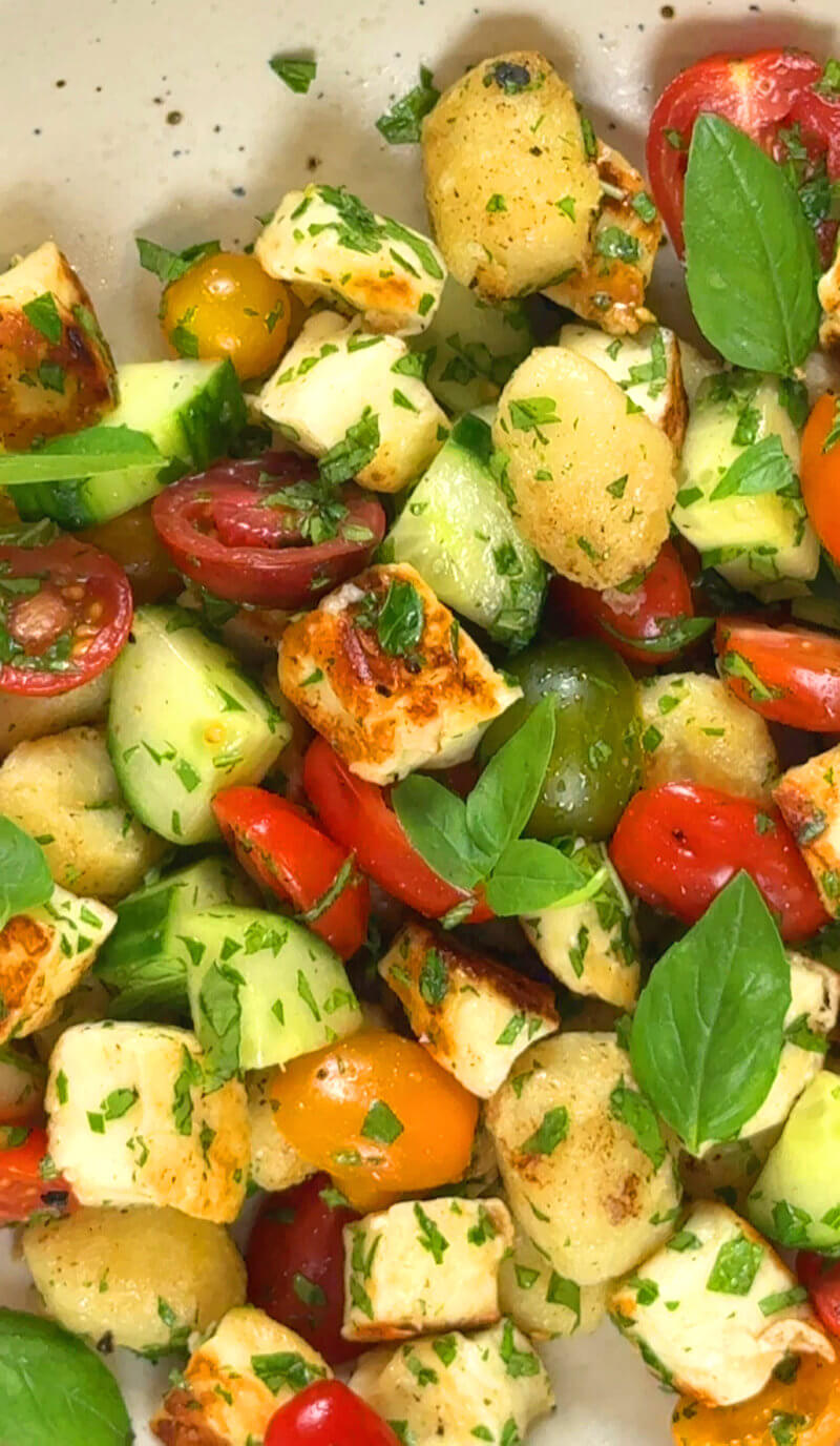 Close-up image of Crispy Gnocchi with Halloumi & Tomato