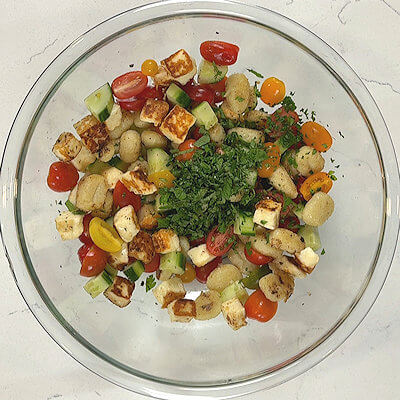 Step 6 - Top the bowl with finely chopped basil, parsley and mint.  Taste and season with salt & pepper if needed.