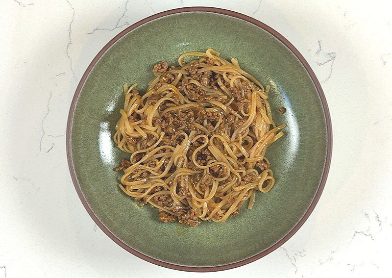Green bowl with Mongolian Beef & Rice Noodles, but without garnish