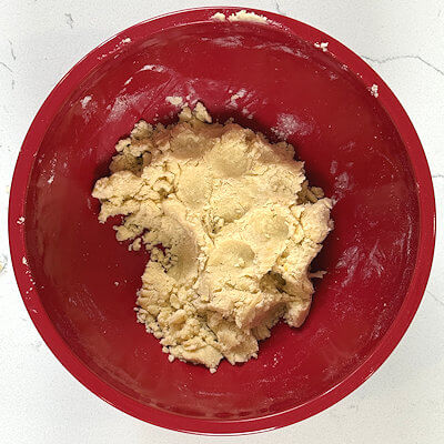 Step 3 - Mix flour and salt in a separate bowl and add that to the butter-sugar mixture. Mix until all the flour is dispersed and you'll end up with a crumbly dough.