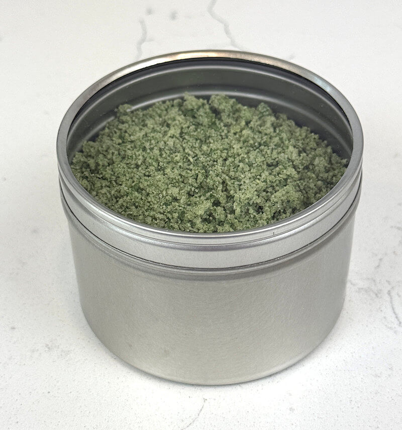 Basil salt in a fancy metal jar for gift giving.