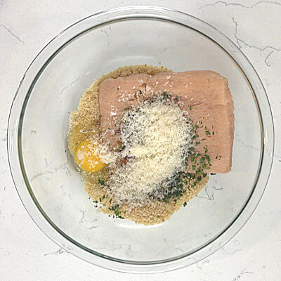 Step 1 - Combine ground chicken, bread crumbs, milk, Parmigiano Reggiano cheese, egg, parsley, herbs, spices and salt in a bowl. Mix until just combined. 