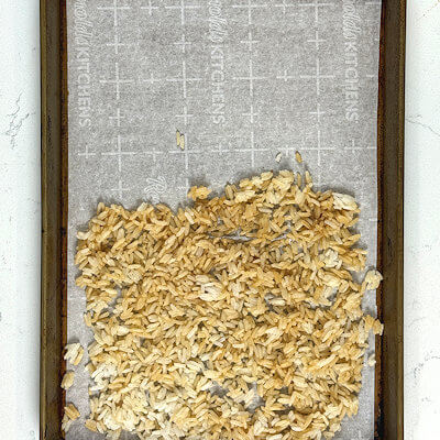 Step 1 - Toss the left-over rice with soy sauce and olive oil and spread it out on a baking sheet lined with parchment paper in a single layer.