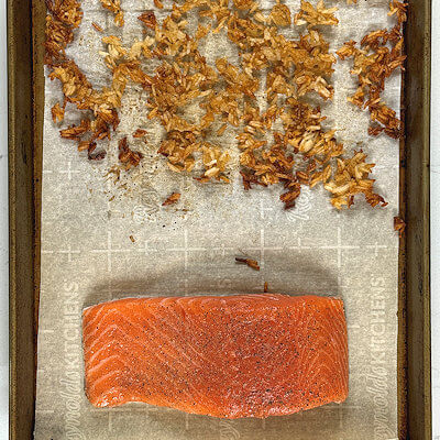 Step 2 - Toss the rice and place a salmon fillet on the same baking sheet. Return back to the oven and bake for another 10-20 minutes. If you rice becomes too crispy, remove it from the baking sheet and continue baking the salmon until it reaches your desired level of doneness.