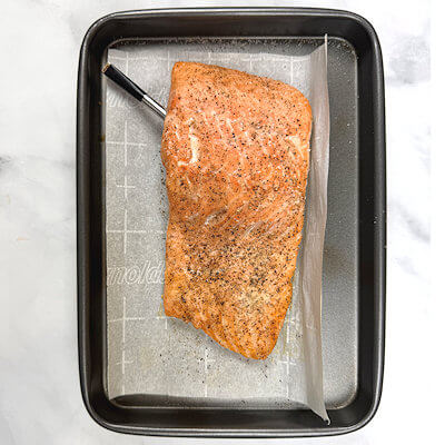 Step 1 - Heat  the oven to 400°F and line a baking sheet with parchment paper. Season the salmon with salt & pepper and place it on the parchment paper. Insert the Meater, if you have one, and cook the salmon until it reaches the doneness you prefer. Allow to cool a little.