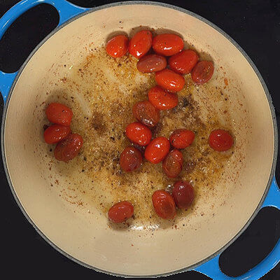Step 2 - Increase the heat and add the tomatoes to the rendered fat. Sprinkle with a little bit of salt & pepper. When the tomatoes start to burst, take them out of the pan and set aside.