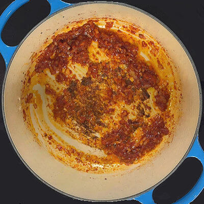 Step 4 - Add the tomato paste and cook for about 1 minute; the color will darken slightly.