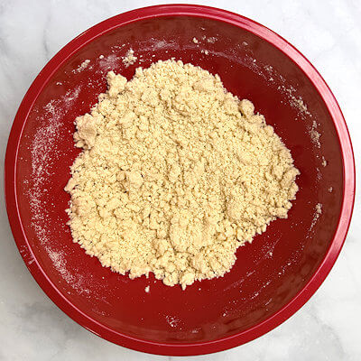 Step 1 - Beat the butter and sugars together in a mixing bowl until light and fluffy, this will take about 2 minutes. Add the flour and salt and mix on low speed until the mixture is clumping together in small crumbles. You can do this easily with a hand mixer.