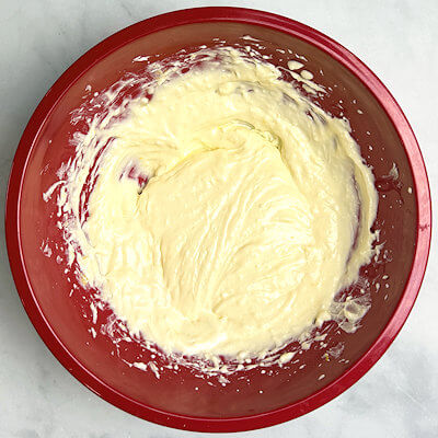 Step 3 - In a bowl, combine cream cheese, sugar, lemon juice and lemon zest and process until smooth. Add the egg and process again until smooth.