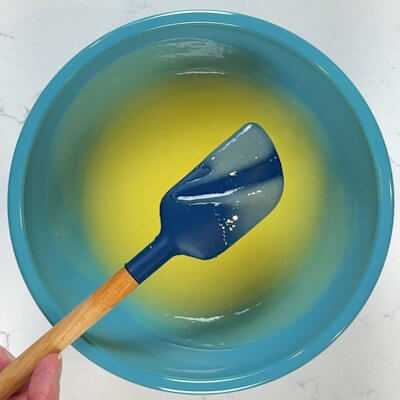 Step 5 - For the lemon curd, whisk and combine lemon juice, sugar and eggs until most of the sugar is dissolved. Pour it into a saucepan and heat over low-medium heat until the curd is thickening (do not boil). The temperature of the lemon curd should be 170°F. The lemon curd should leave a path on the back of a spoon in about 10 minutes. Take the curd off the heat, add the butter, and stir until the butter has melted. If you have lumps pour the curd through a strainer.