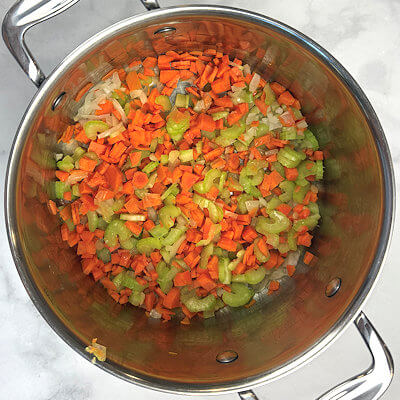 Step 1 - Heat olive oil in a medium pot and add the carrot, celery and onion. Stir and saute them in the oil for about 5 minutes, until they begin to soften.